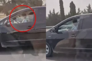 Sürücü "Prius"u qucağında uşaqla sürdü - VİDEO