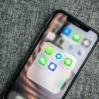 whatsapp app icon on a phone with other messaging apps