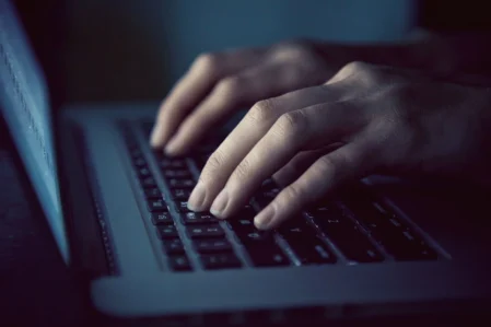 46650591 hands with laptop typing in night 720x720 1200 1