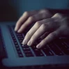 46650591 hands with laptop typing in night 720x720 1200 1