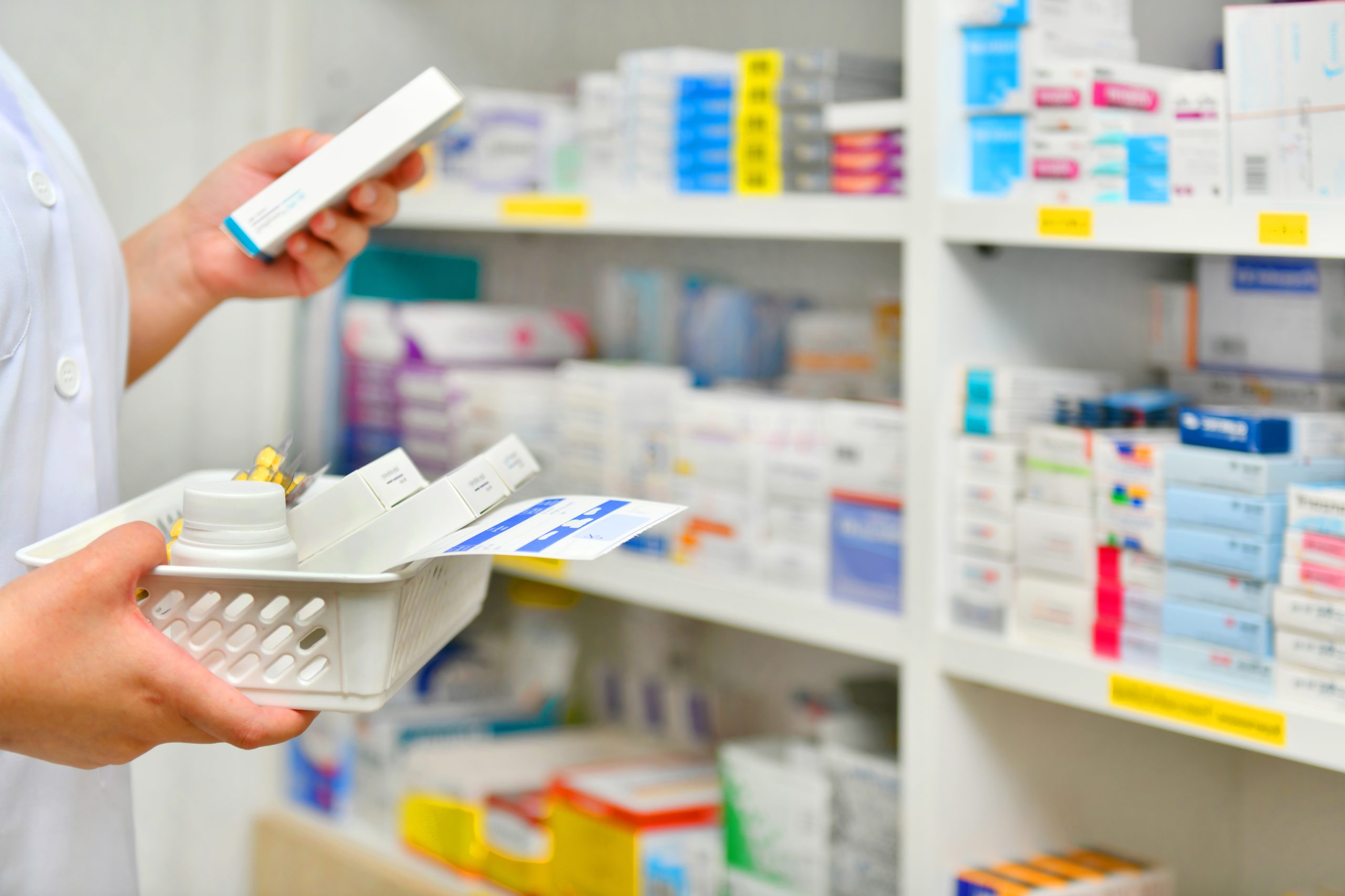 pharmacist filling prescription pharmacy drugstore scaled
