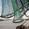 close up fishing net against blue sky