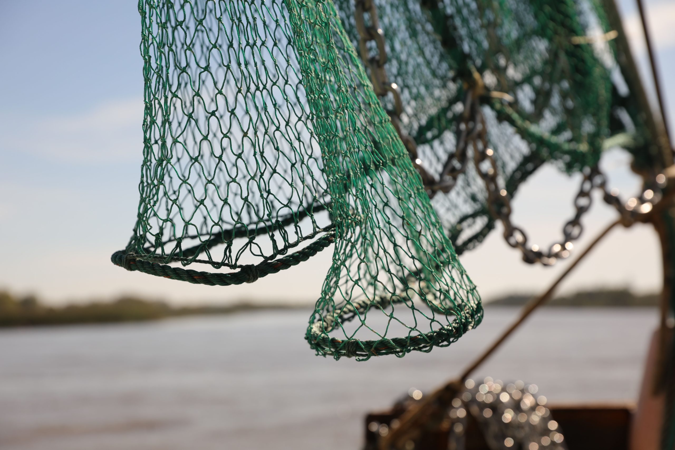 close up fishing net against blue sky scaled