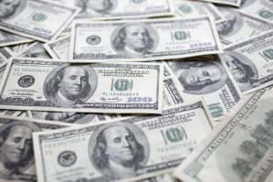 dollar bills scattered table