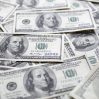 dollar bills scattered table