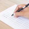 closeup person filling out questionary form