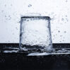 clear water glass with water drops