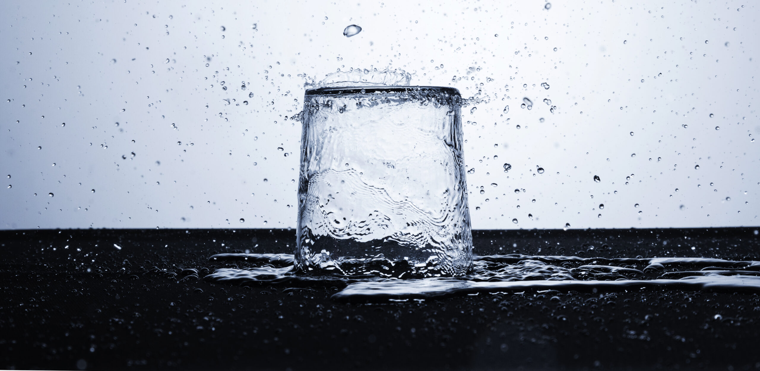 clear water glass with water drops scaled