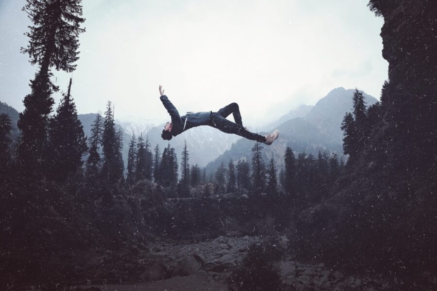 man jumping against sky scaled 1