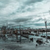 landscape building ruins bare trees water cloudy sky gloomy day