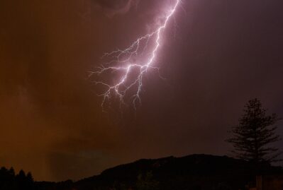 lightning night sky mountains with trees