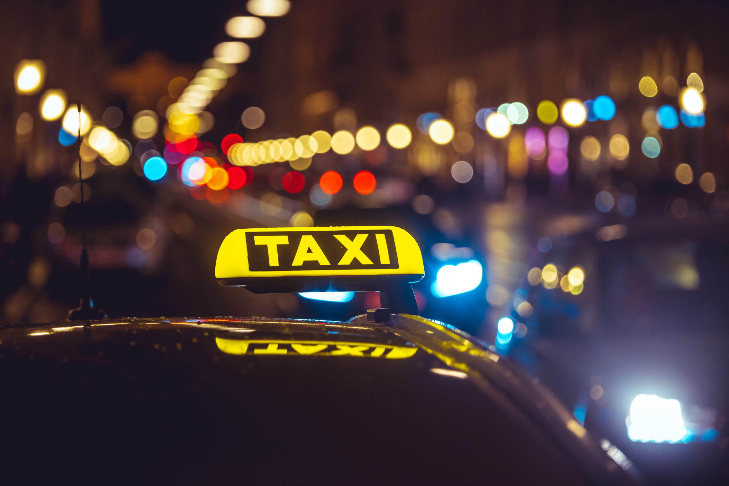 taxi car bokeh lights scaled
