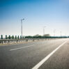 asphalt road forest
