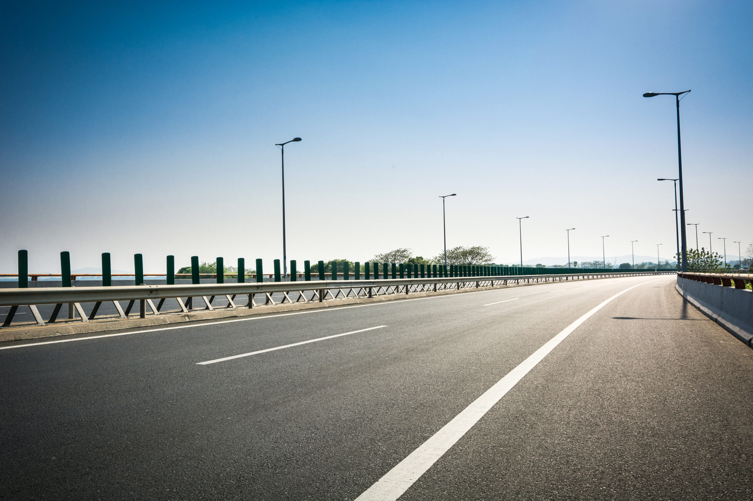 asphalt road forest scaled