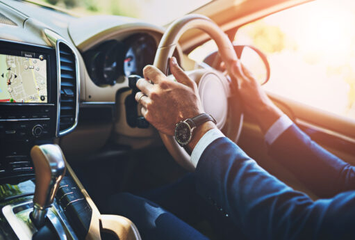 man hands travel driving car commute steering wheel en route business trip transport navigation display screen professional driver work journey automobile with gps map